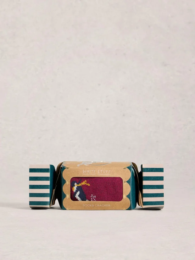 Skilaufende Pinguine im Cracker